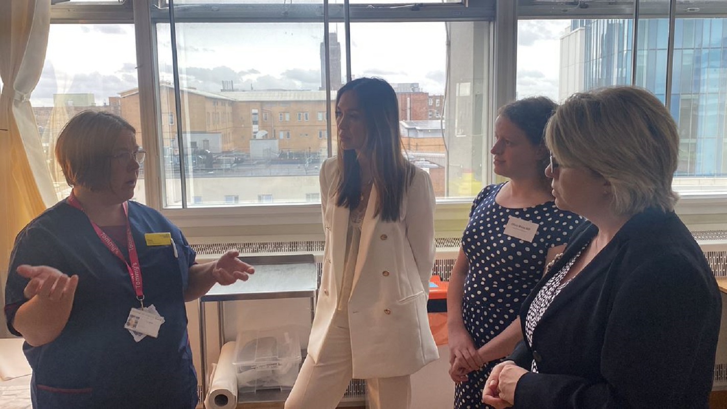 l-r Tina in nurse's uniform, as Myleene, Olivia and Maria listen to her speak