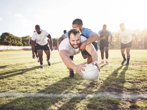 Rugby player scoring a try